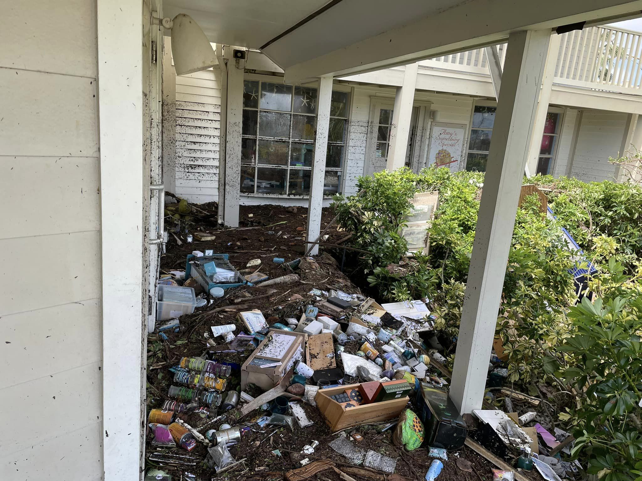 Hurricane Ian left Suncatchers' Dream in devastating condition, boxes of products among ruins.