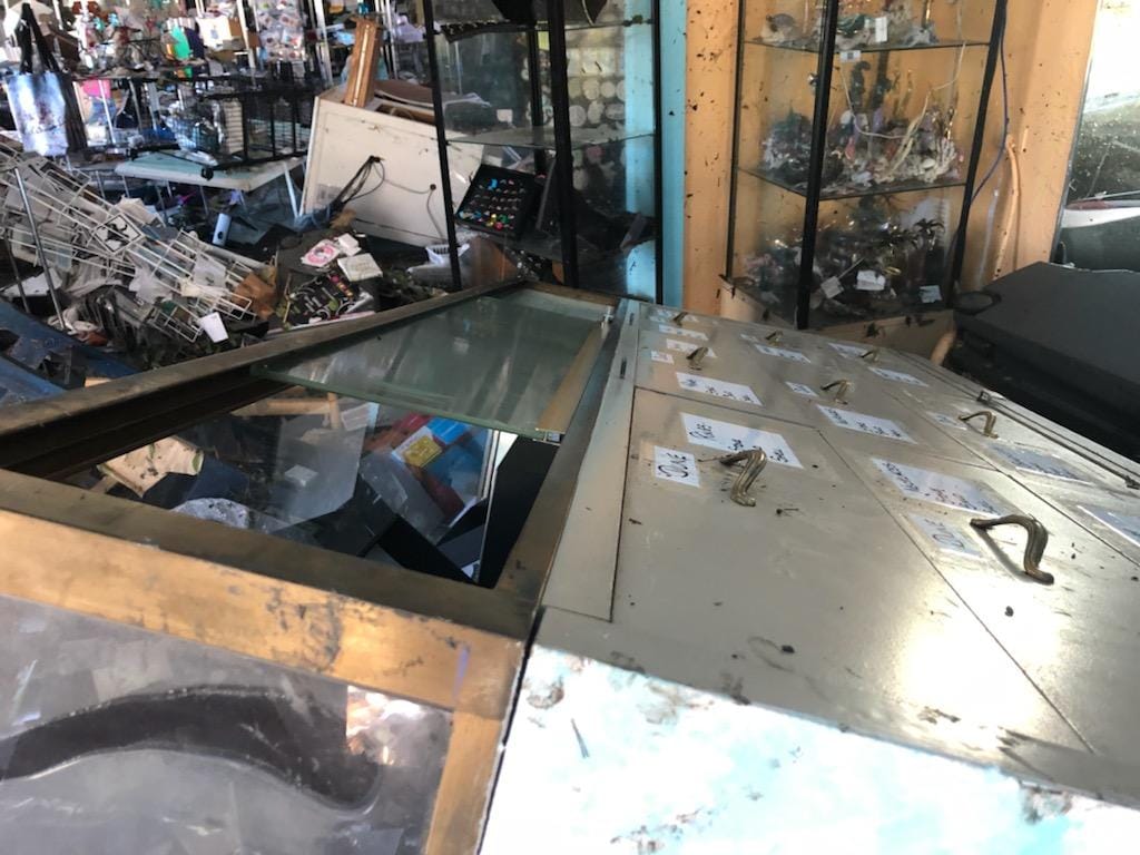 Hurricane Ian left Suncatchers' Dream in devastating condition, boxes of products among ruins.