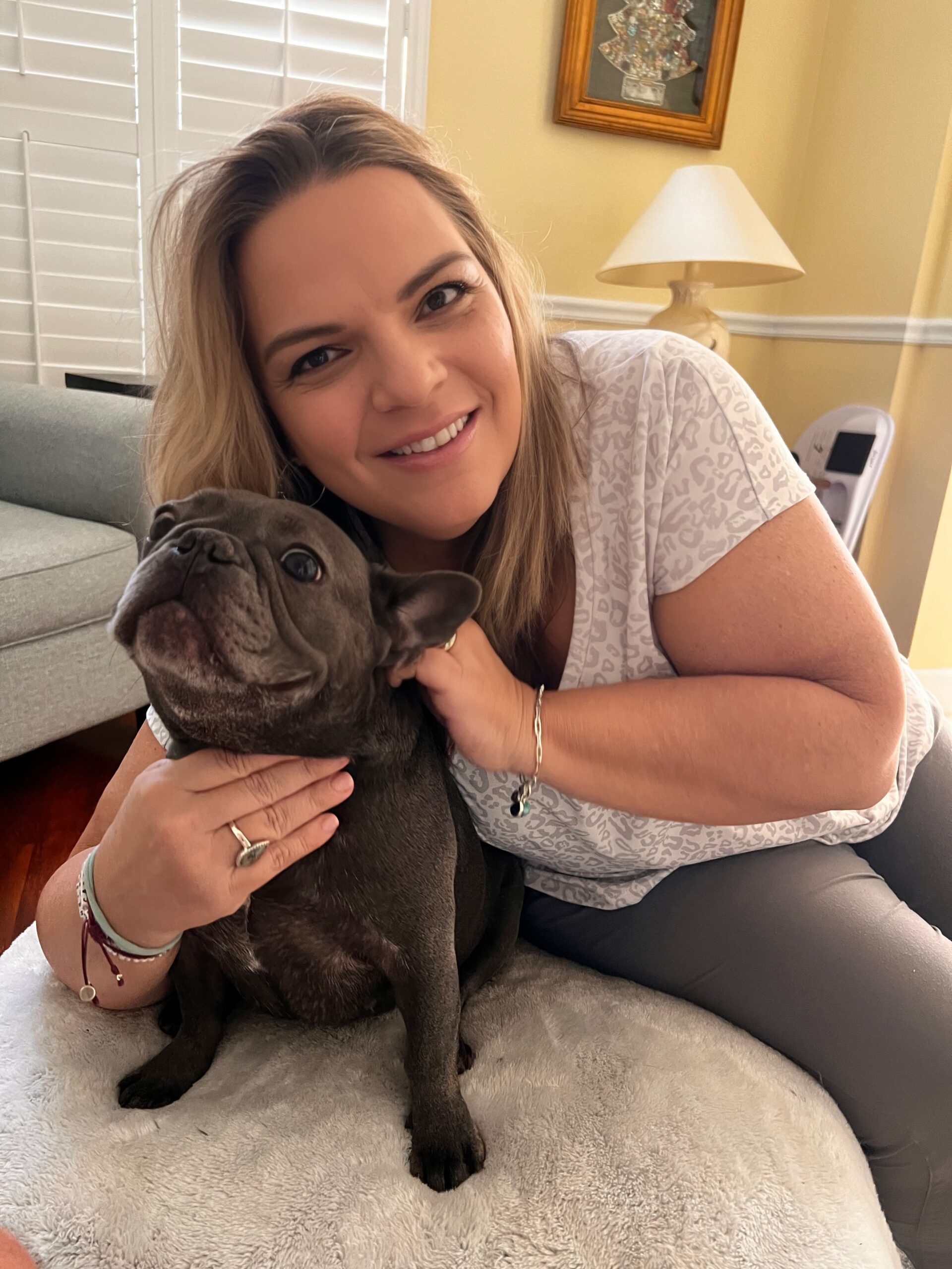 Carole and her French Bulldog Stella posing for the camera.