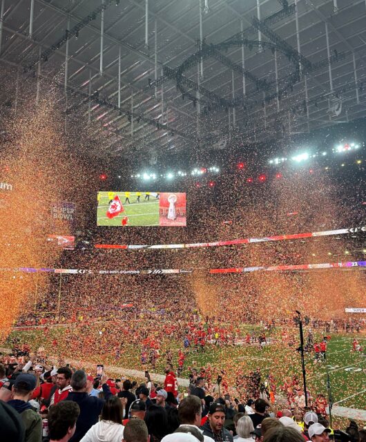Super Bowl orange confetti in air.