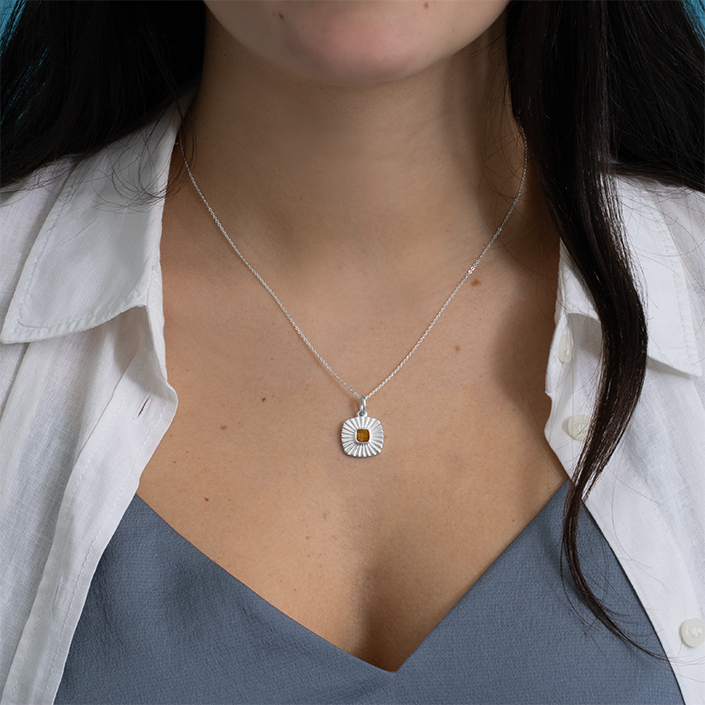 Cape Cod sunshine necklace with travel-inspired charms in sterling silver. Collectible charm sun necklace.