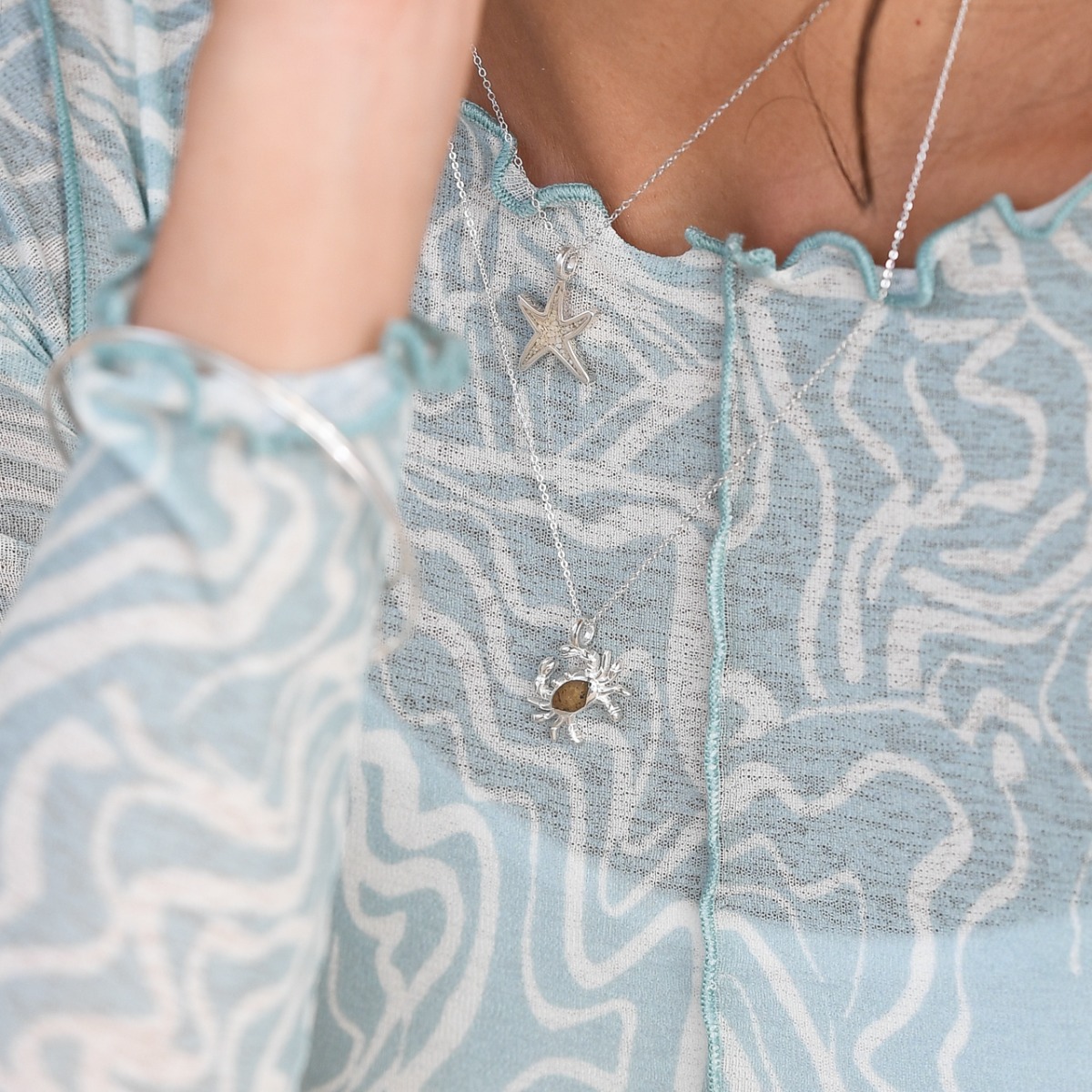 Crab Larimar necklace, ocean blue stone necklace womens and custom jewelry gifts made with beach sand, gemstones, or elements. Beach jewelry larimar pendant custom crafted with real blue larimar stone. Luxury personalized housewarming gifts. What is the b