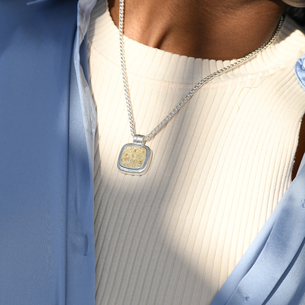 Discover abalone necklace meaning with this bold masculine cushion cut and chain design in sterling silver with sand, stones, or shells, and abalone shell fragments.
