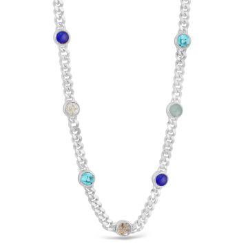 Sterling silver chain necklace with seven customizable sand and earth element settings, inspired by travel memories made in every continent.
