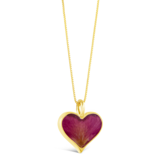 This heartwarming design features a 14k gold vermeil heart handcrafted with sand, shells, or earth elements from your favorite location.