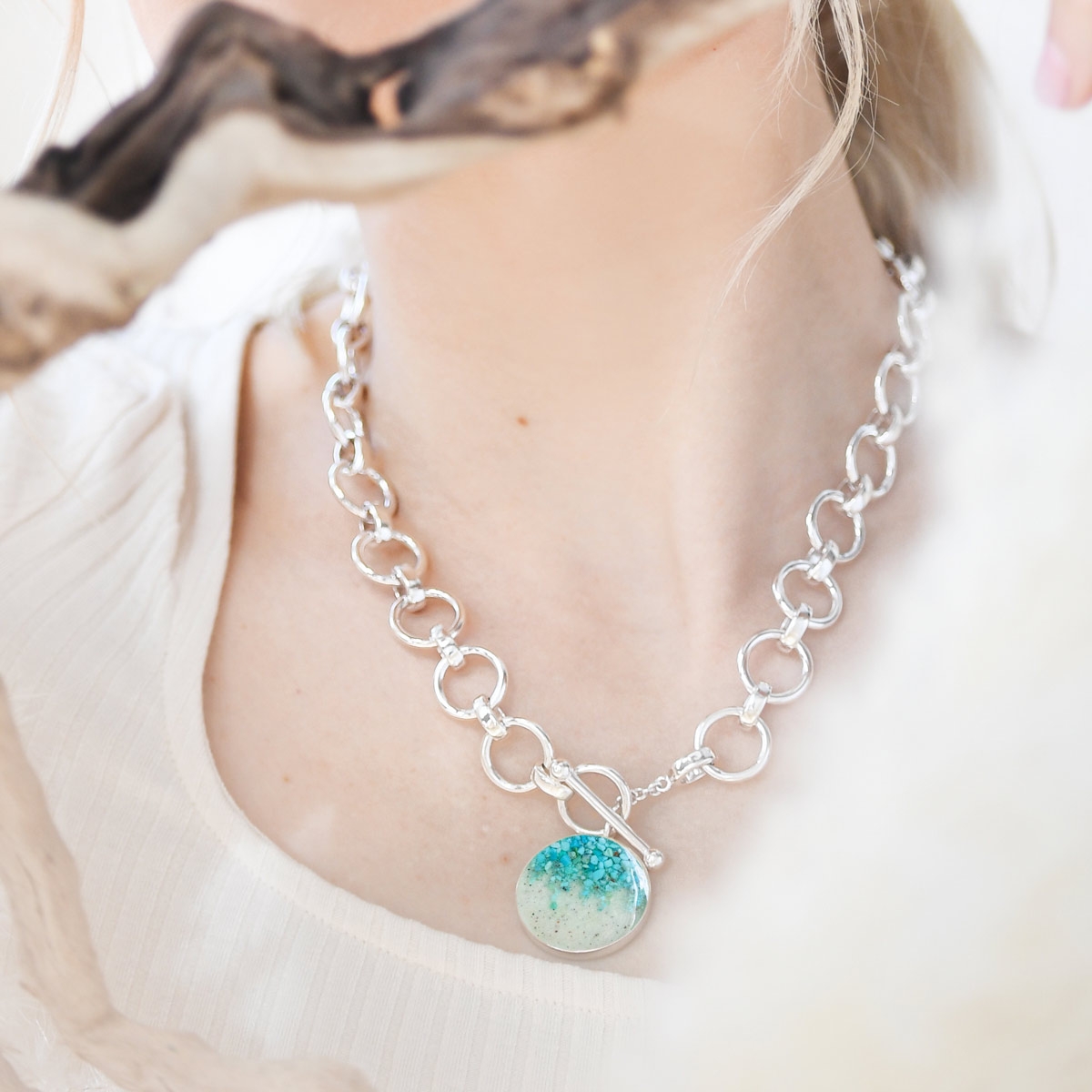 What is the best jewelry for a beach wedding? Dune specializes in ocean-inspired gifts including this large round necklace with turquoise stone. Custom silver statement necklace. Memory jewelry and Caribbean jewelry. Beach necklace.