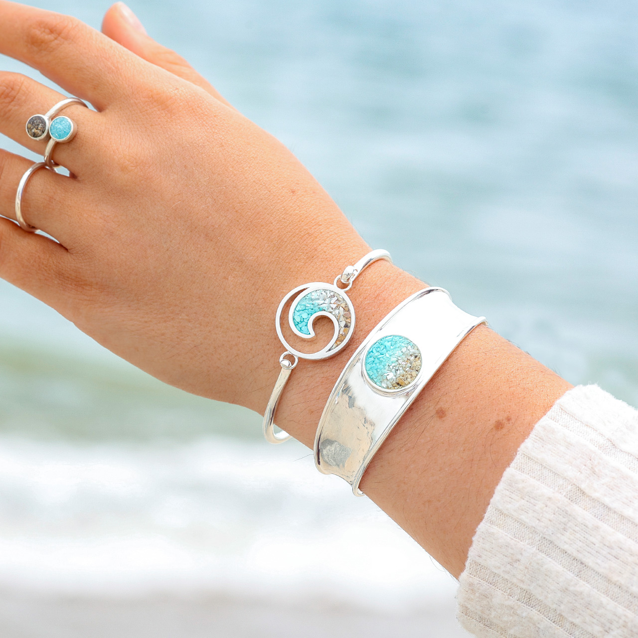 Nautical bracelet handcrafted with sterling silver featuring an ocean wave, ocean gradient design and your choice of sand or element. Great simple yet elegant jewelry design for ocean aficionados and beach lovers.