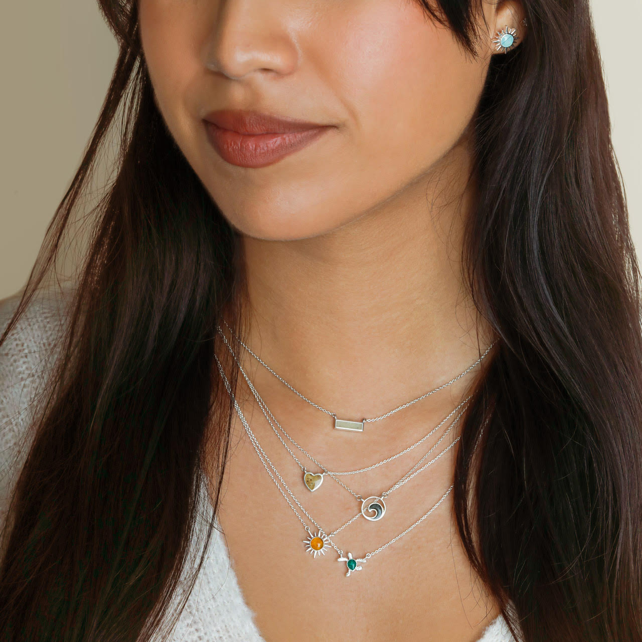 Ocean wave jewelry featuring turquoise stone, customizable with your favorite beach sand, shells, or earth elements. Nautical jewelry and ocean-inspired gifts. Beachy necklaces