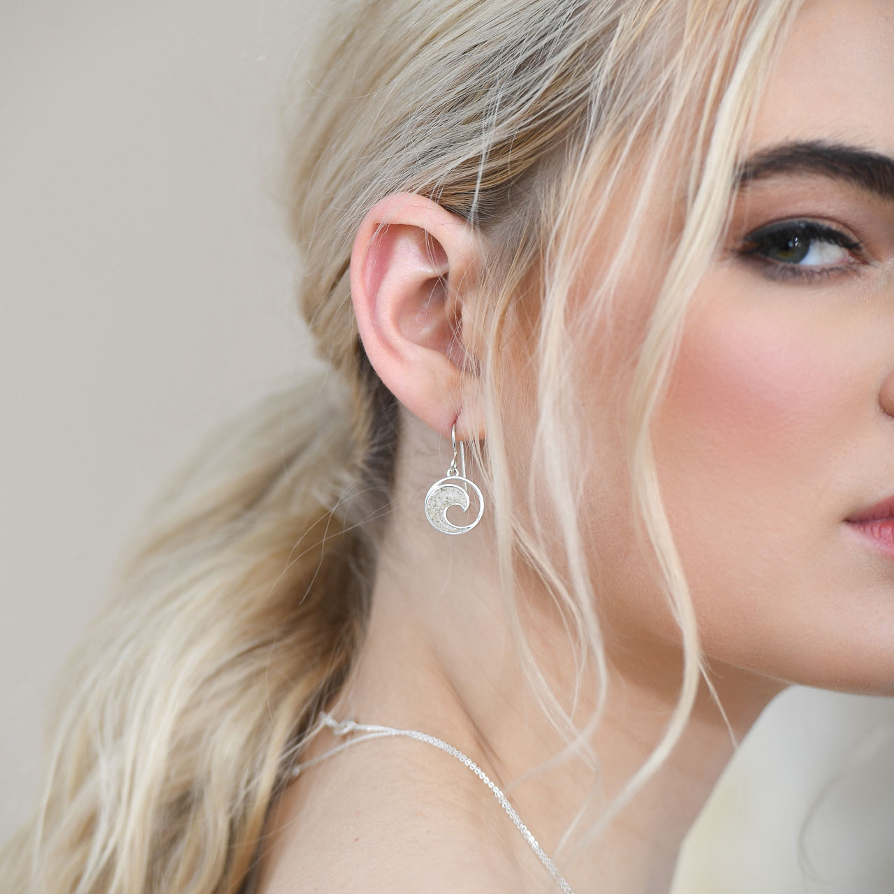Crescent wave drop earrings made with sterling silver and beach sand, stones, or earth elements. Gorgeous wave jewelry to match any outfit.